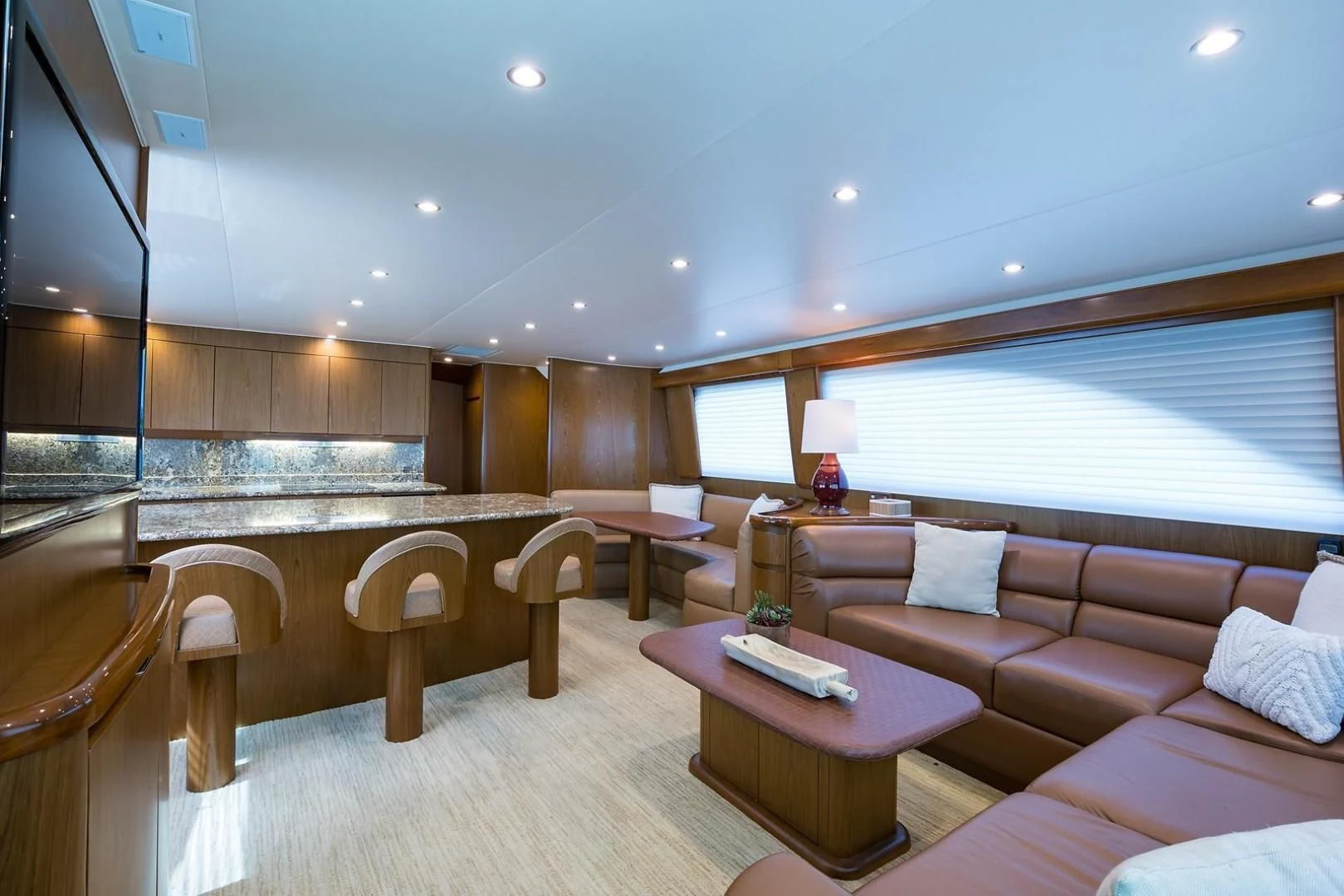 a large living room with a large window aboard LAST CALL Yacht for Sale