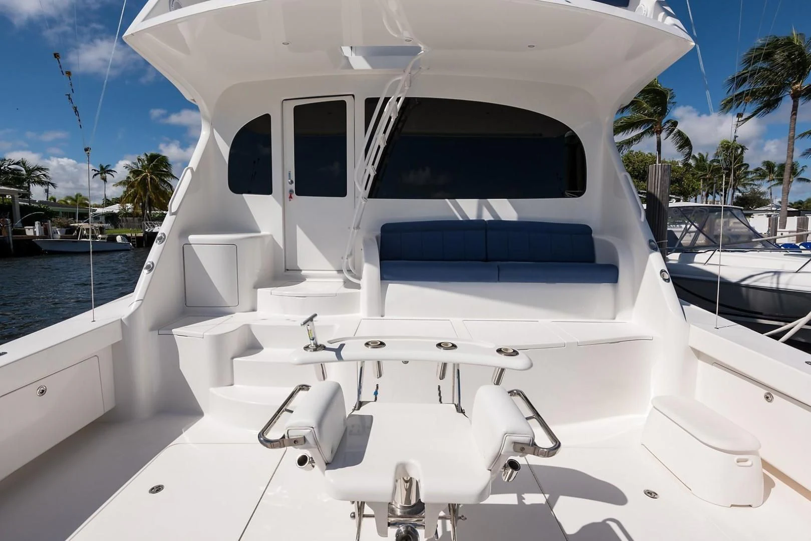 a white boat on a beach aboard LAST CALL Yacht for Sale