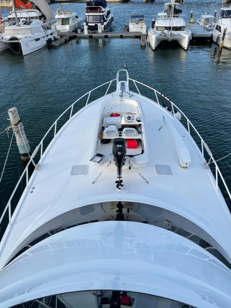 a large white boat in the water aboard LAST CALL Yacht for Sale