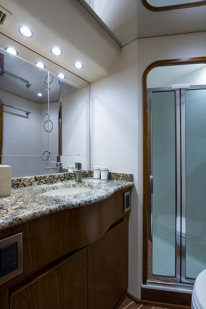 a bathroom with a sink and a shower aboard LAST CALL Yacht for Sale