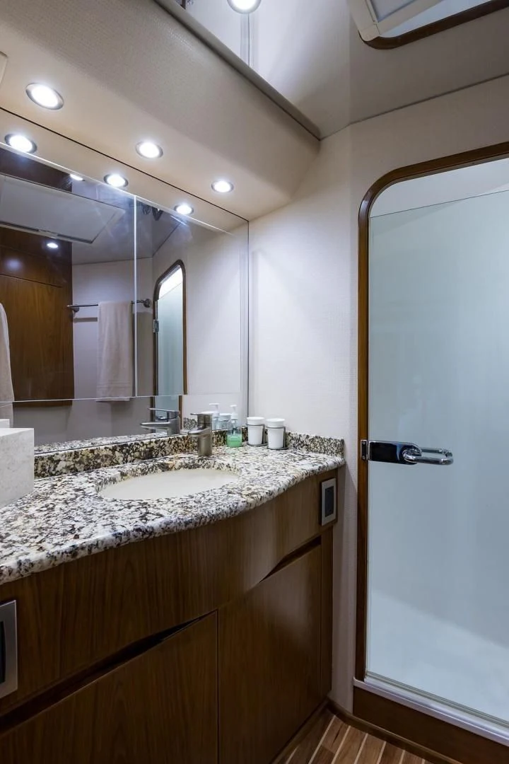 a bathroom with a large mirror aboard LAST CALL Yacht for Sale