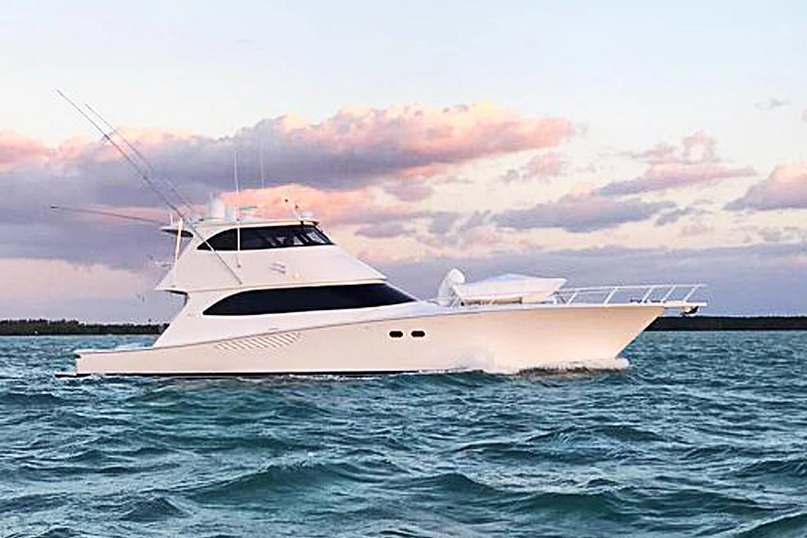 a white yacht in the water aboard LAST CALL Yacht for Sale