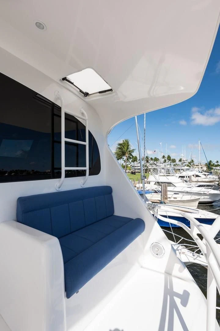 a boat with a blue cover aboard LAST CALL Yacht for Sale
