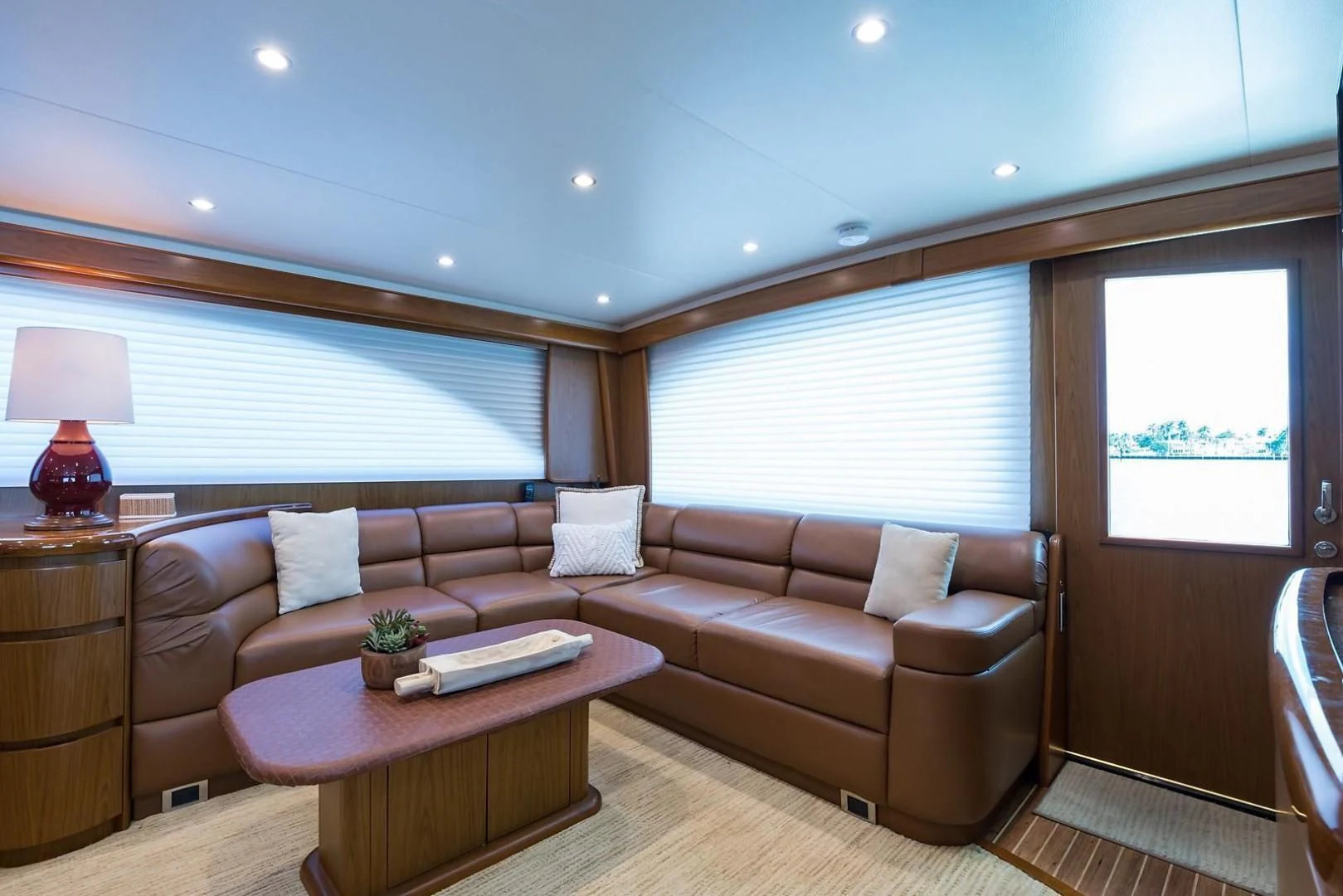 a living room with a couch and a coffee table aboard LAST CALL Yacht for Sale