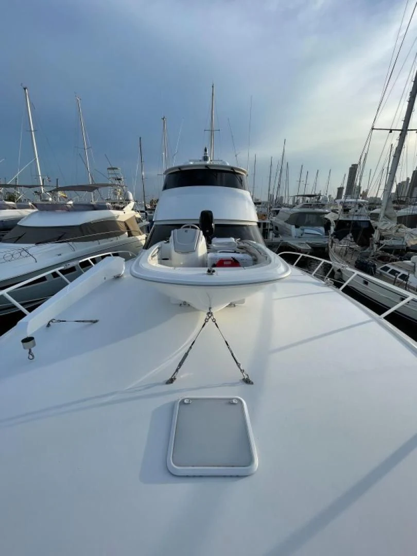 a group of boats are parked in a harbor aboard LAST CALL Yacht for Sale