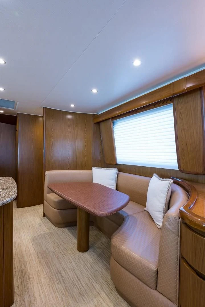 a room with a couch and a table aboard LAST CALL Yacht for Sale