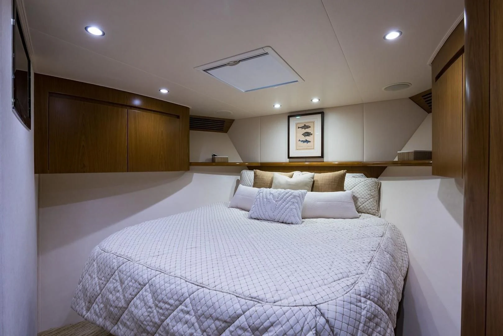 a bed with white sheets aboard LAST CALL Yacht for Sale