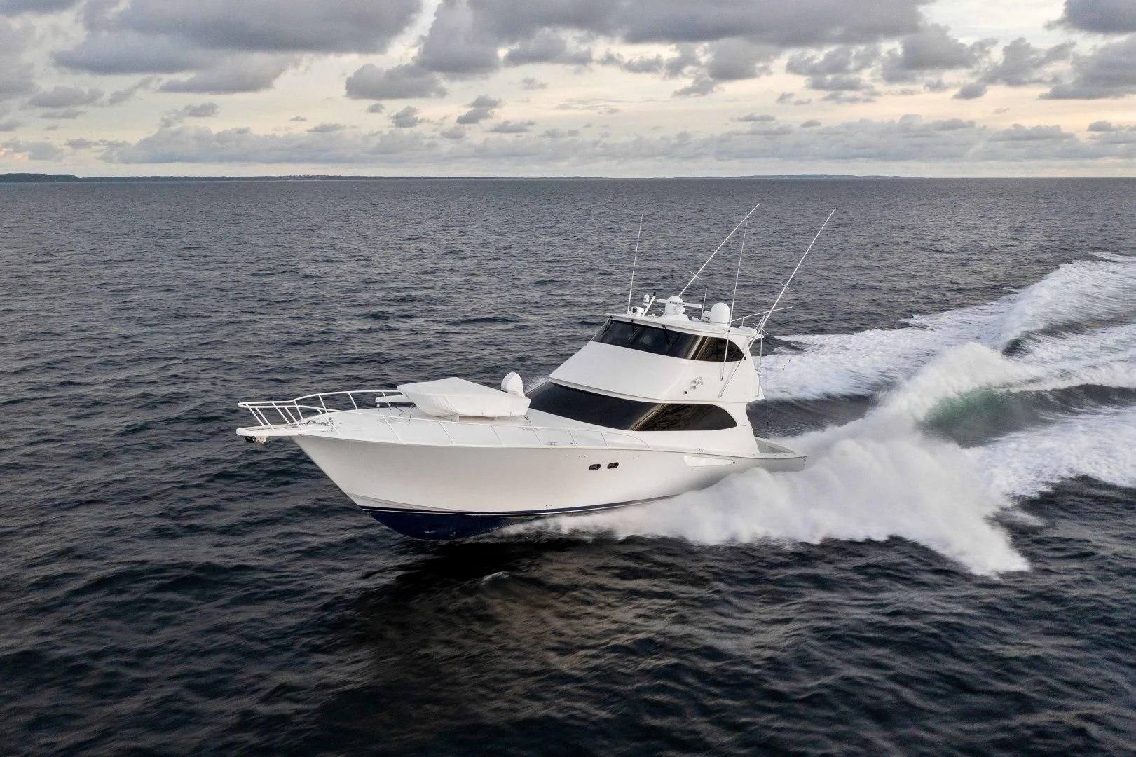 a white boat on the water aboard LAST CALL Yacht for Sale