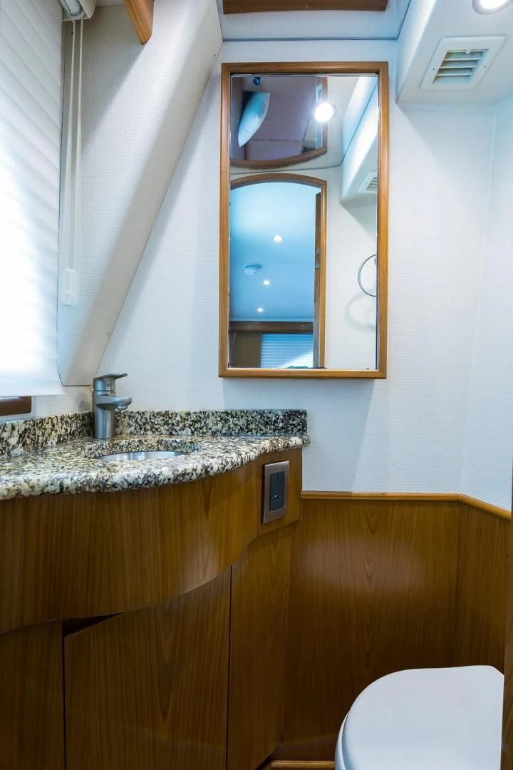 a bathroom with a marble counter top aboard LAST CALL Yacht for Sale