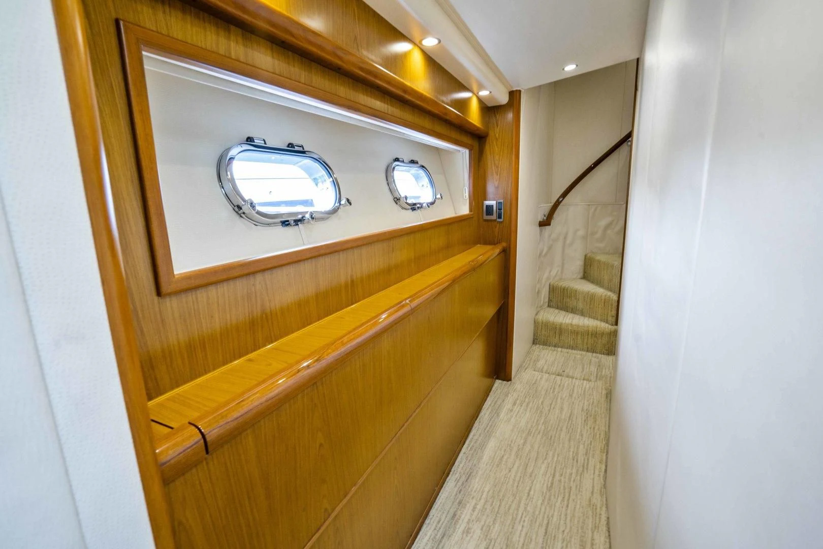 a wooden cabinet with a mirror above it aboard LAST CALL Yacht for Sale