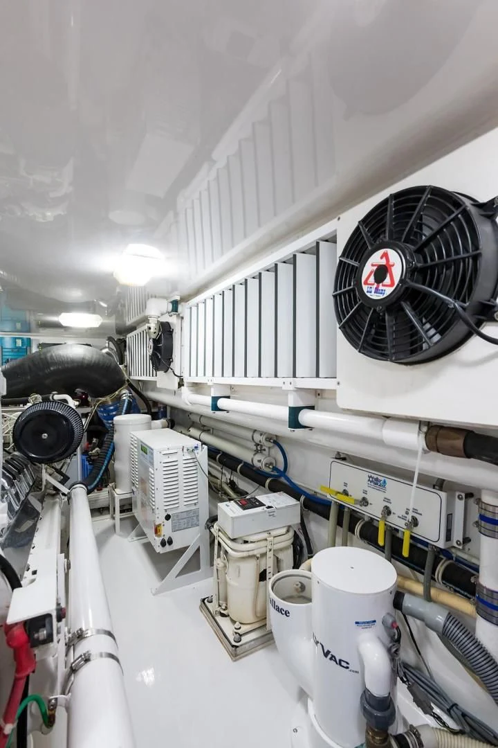 a white room with several white pipes aboard LAST CALL Yacht for Sale