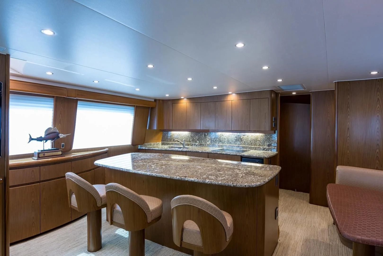 a kitchen with a table and chairs aboard LAST CALL Yacht for Sale