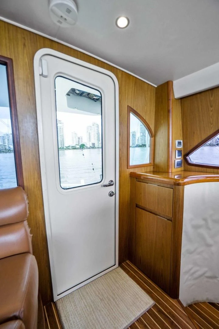 a room with a door and a window aboard LAST CALL Yacht for Sale