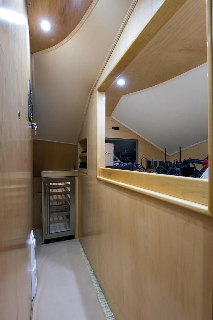 a room with a machine and a shelf with objects on it aboard LAST CALL Yacht for Sale