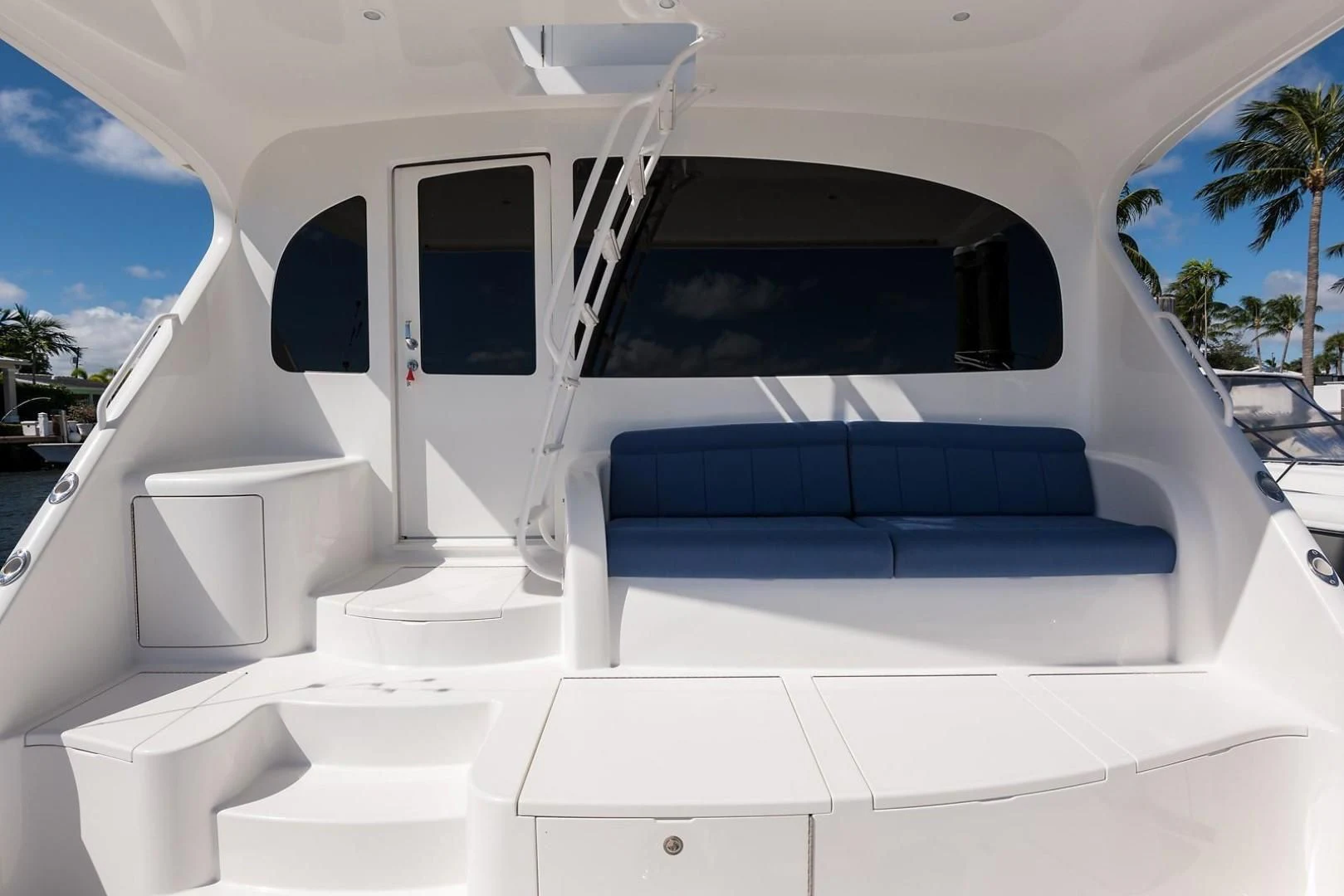 a white car with a door open aboard LAST CALL Yacht for Sale