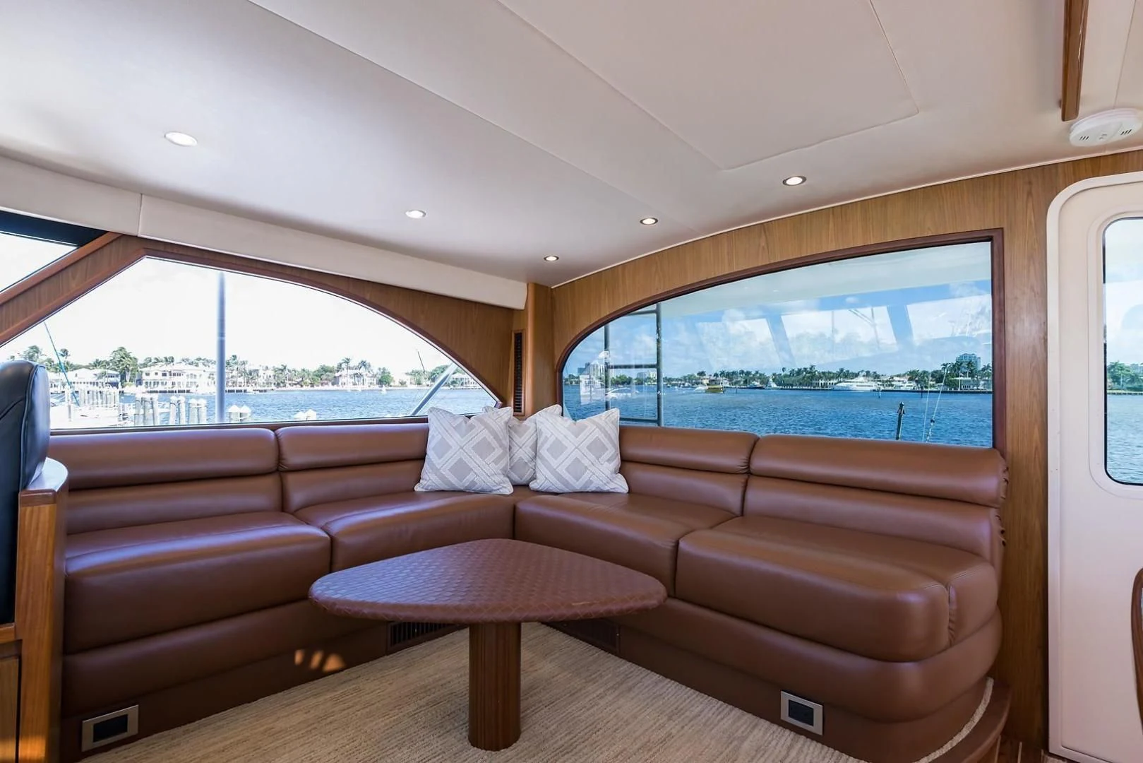 a living room with a couch and a table aboard LAST CALL Yacht for Sale