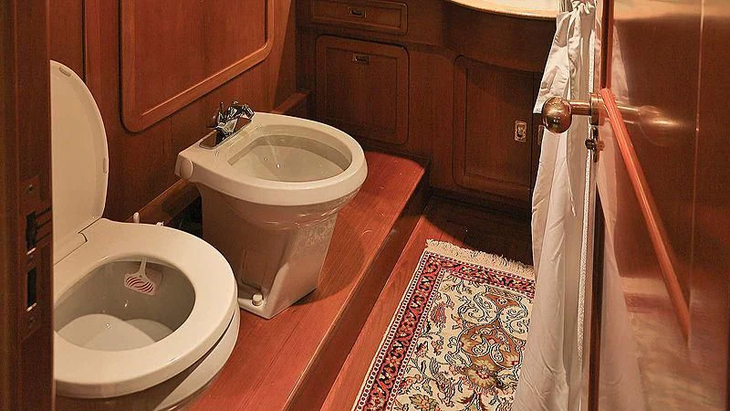 a bathroom with a toilet and sink aboard NORDIC STAR Yacht for Sale