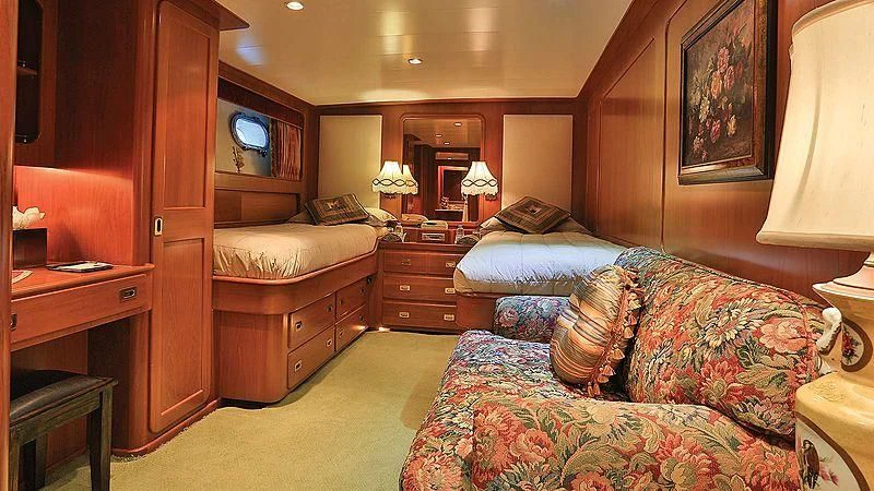 a bedroom with a bed and a desk aboard NORDIC STAR Yacht for Sale