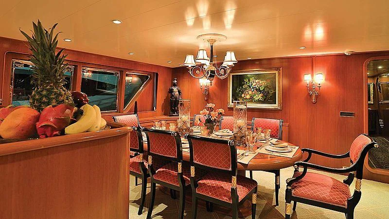 a room with a table chairs and a christmas tree aboard NORDIC STAR Yacht for Sale