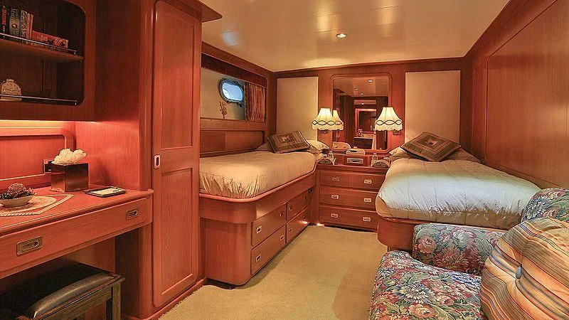 a bedroom with a desk and a bed aboard NORDIC STAR Yacht for Sale