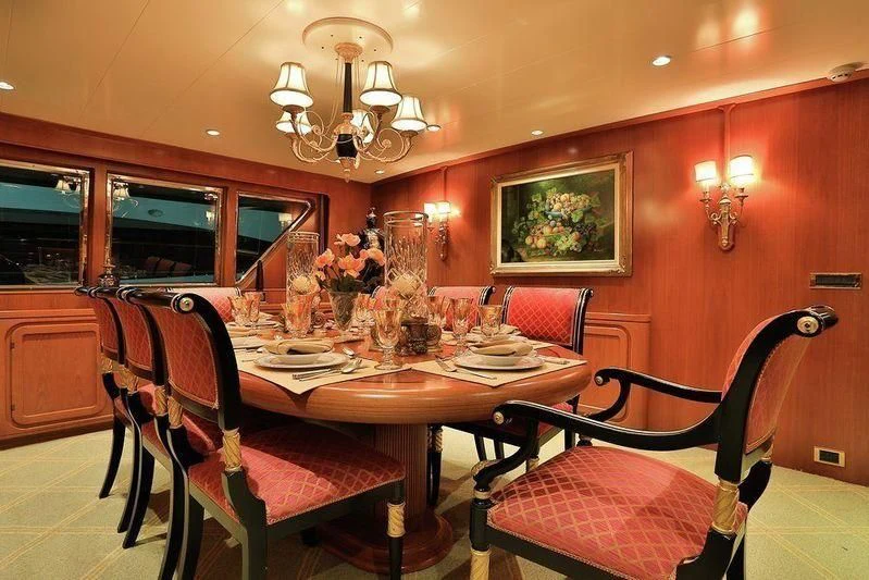 a dining room with a table and chairs aboard NORDIC STAR Yacht for Sale