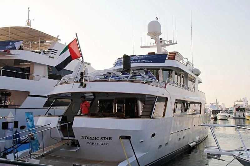 a boat with flags on it aboard NORDIC STAR Yacht for Sale
