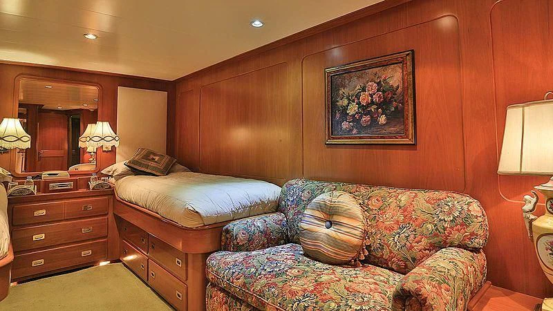 a bedroom with a bed and a dresser aboard NORDIC STAR Yacht for Sale