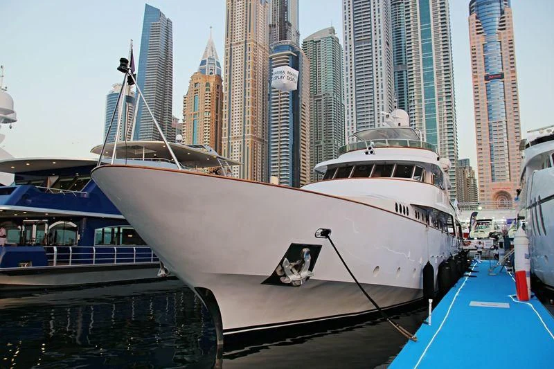 a white yacht in a harbor aboard NORDIC STAR Yacht for Sale