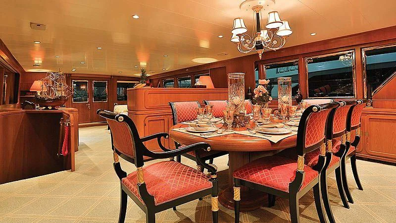 a dining room with a table and chairs aboard NORDIC STAR Yacht for Sale
