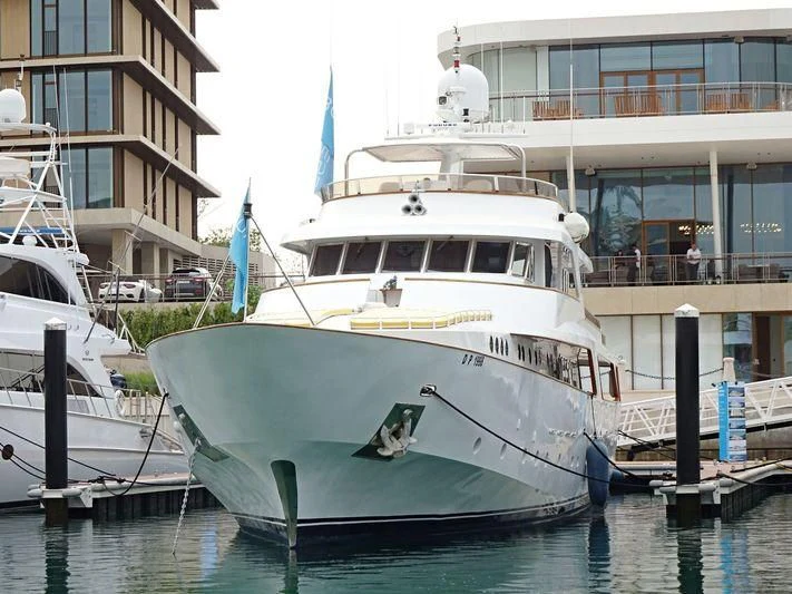 a white boat in a harbor aboard NORDIC STAR Yacht for Sale