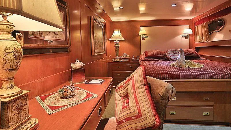 a bedroom with a bed and a desk aboard NORDIC STAR Yacht for Sale