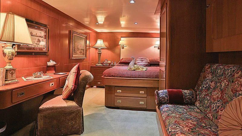 a bedroom with a bed and a desk aboard NORDIC STAR Yacht for Sale