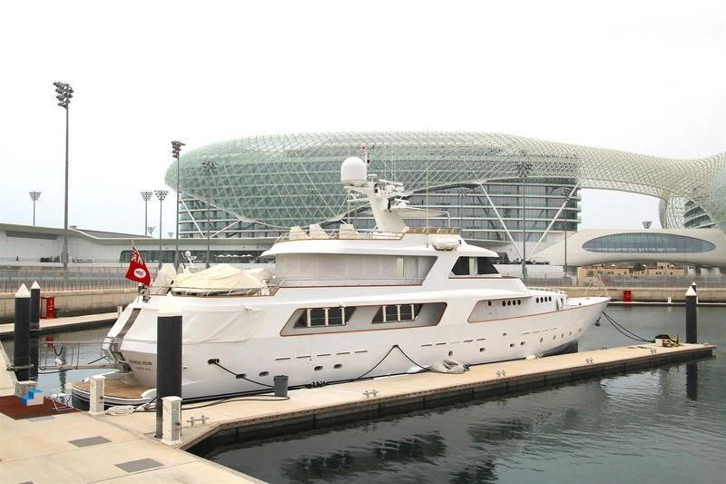 a large white boat in a harbor aboard NORDIC STAR Yacht for Sale