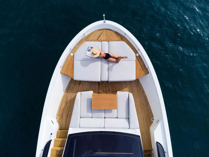 a person in a white suit on a boat aboard DA MOON Yacht for Sale