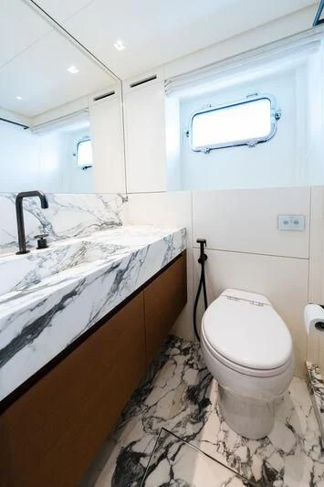 a bathroom with a bathtub and toilet aboard DA MOON Yacht for Sale