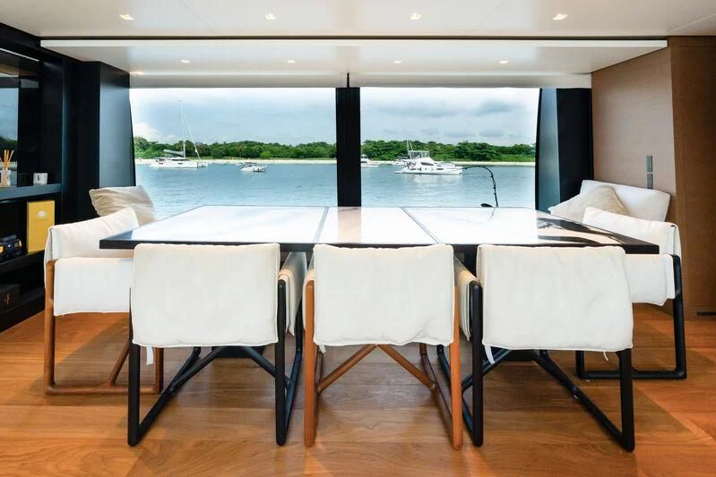 a table and chairs in a room aboard DA MOON Yacht for Sale