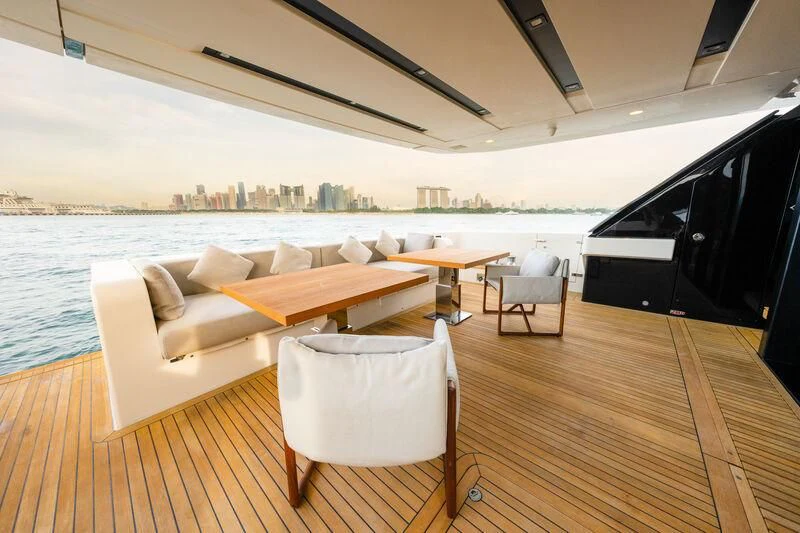 a room with a couch and a table and a large body of water aboard DA MOON Yacht for Sale