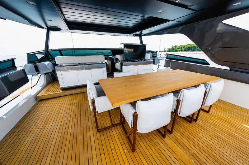 a room with a table and chairs aboard DA MOON Yacht for Sale