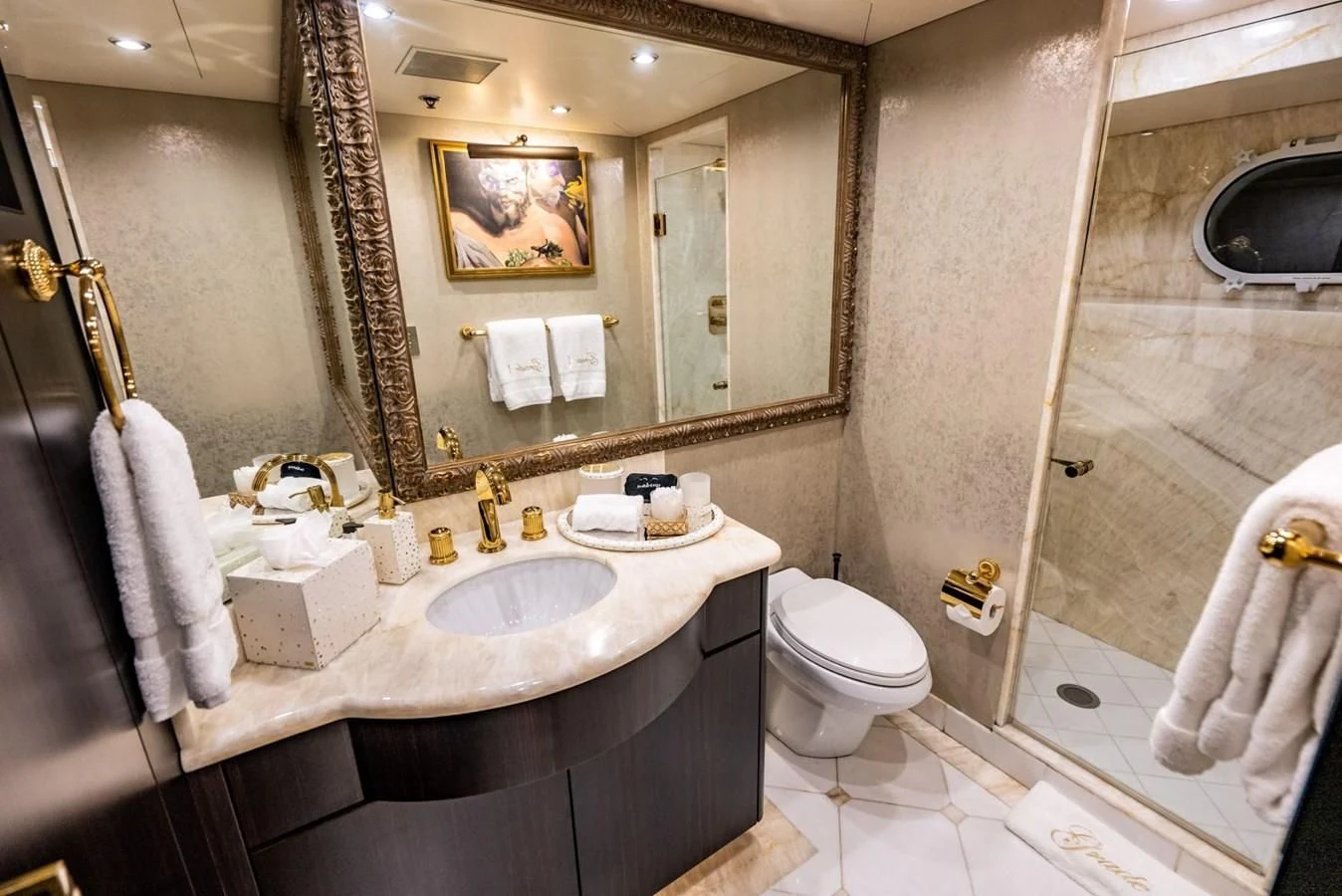 a bathroom with a large mirror aboard GRADE I Yacht for Charter