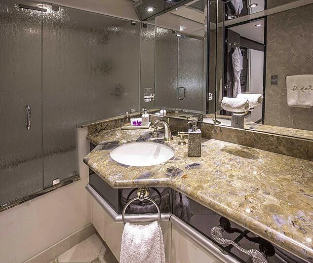 a bathroom with a countertop sink aboard GRADE I Yacht for Charter
