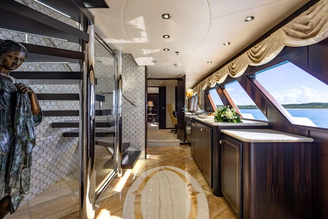 a person standing in a room aboard GRADE I Yacht for Charter