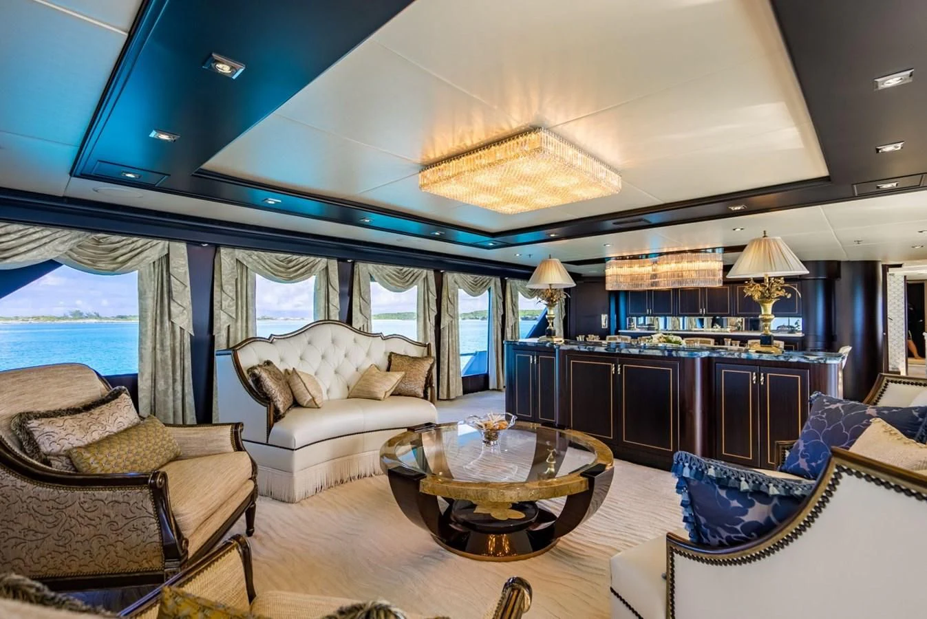 a living room with a large window aboard GRADE I Yacht for Charter
