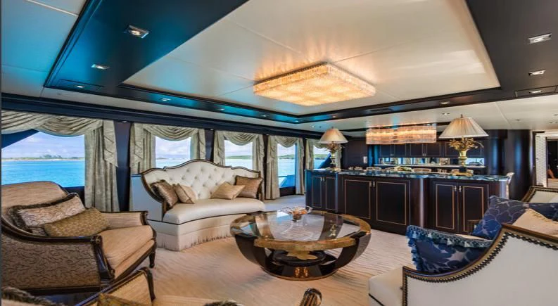 a living room with a large window aboard GRADE I Yacht for Charter