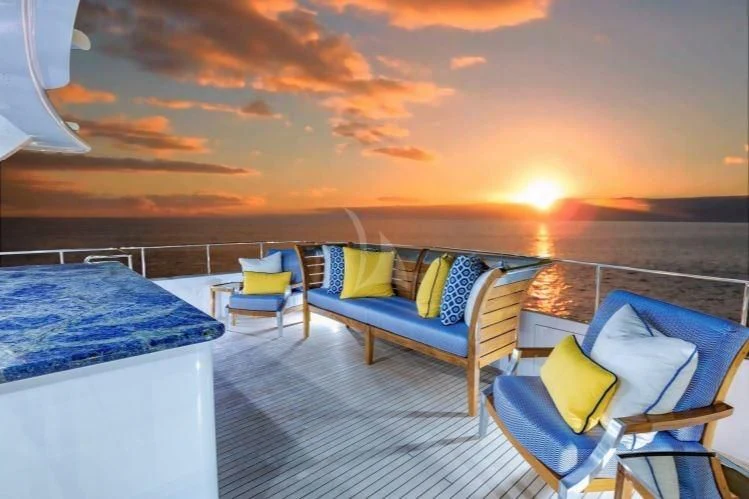 a balcony with a view of the sunset aboard GRADE I Yacht for Charter