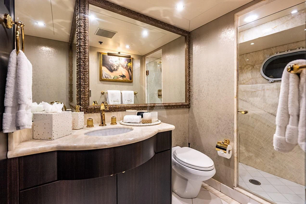 a bathroom with a large mirror aboard GRADE I Yacht for Charter