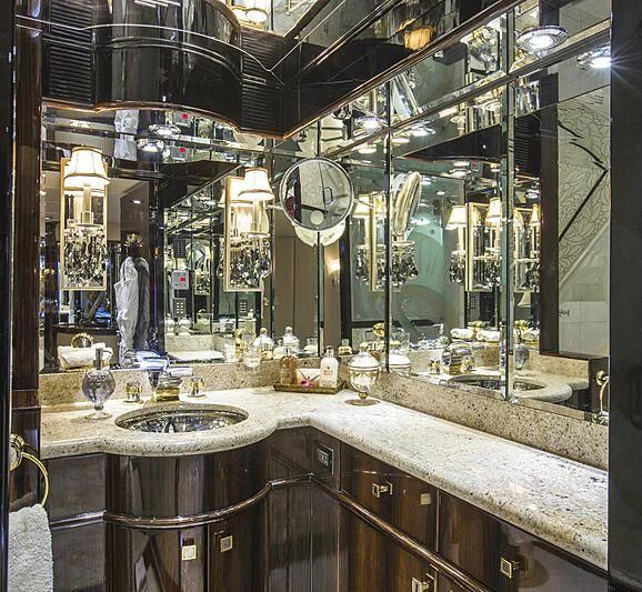 a large bathroom with a large mirror aboard GRADE I Yacht for Charter