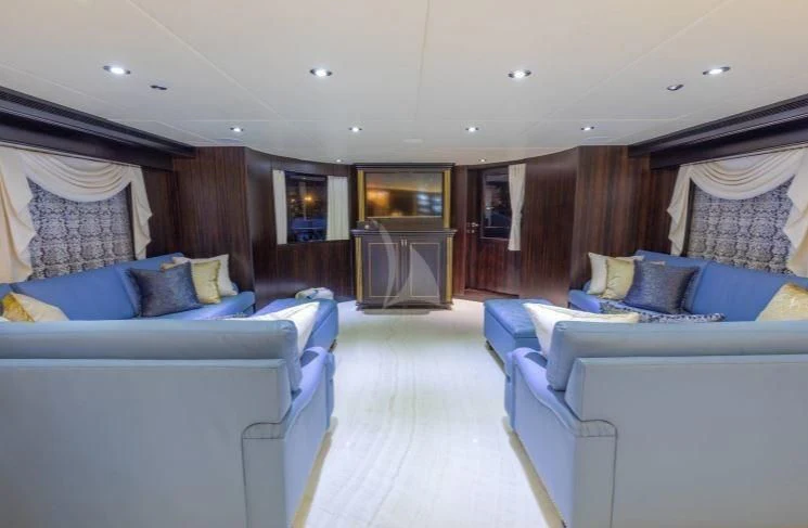 a room with a bed and a table aboard GRADE I Yacht for Charter