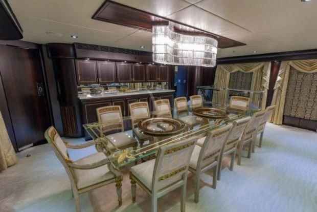 a large room with a table and chairs aboard GRADE I Yacht for Charter