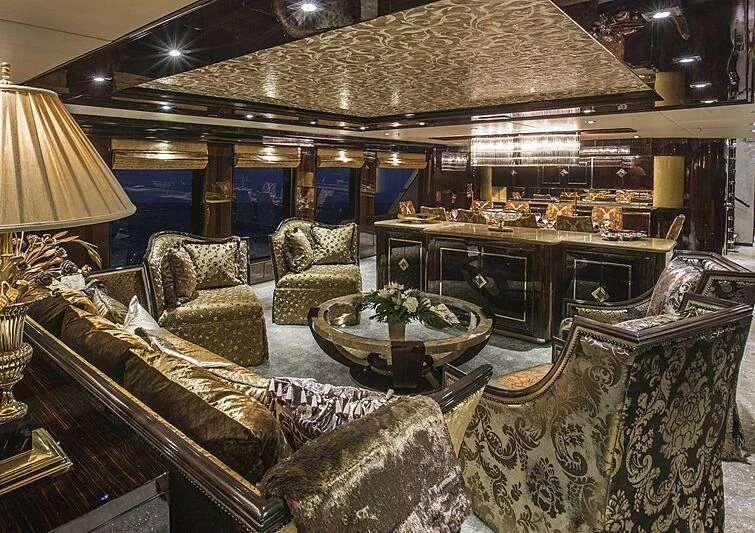 a room with a couch and a table aboard GRADE I Yacht for Charter