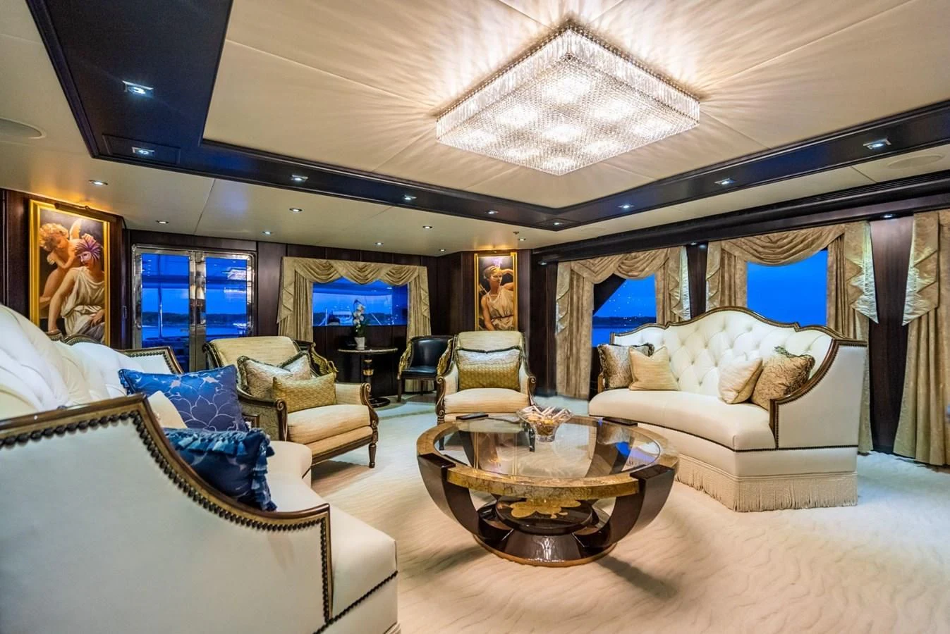 a living room with a large window aboard GRADE I Yacht for Charter